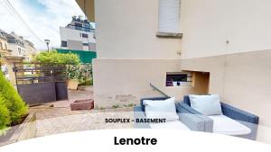 a balcony with a couch and pillows on a building at Les appartements du Général Uhrich - Proche Parlement in Strasbourg +25 photos