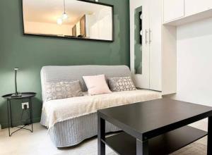 a living room with a couch and a table at Studio 301 - Grand Cerf - Metz hyper center in Metz