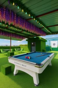 a pool table in a pavilion with a billiards at T1 Stay Manila-Near NAIA Manila Airport and PITX in Manila