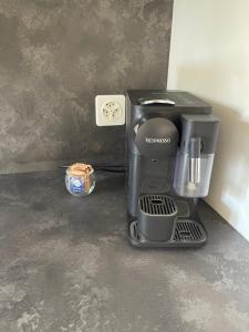 a coffee maker sitting on top of a counter at Vacallo Panorama Apartament - RentuGoo Travel in Vacallo