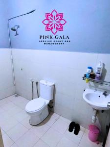 a bathroom with a toilet and a sink at DEEJA Homestaycation Kuantan - Enjoy Private Pool by PG Management in Kuantan