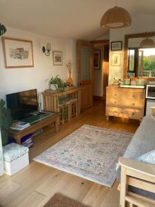 a living room with a couch and a table at Stunning views of Ynyshir & Southern Snowdonia in Machynlleth