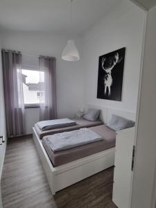 Una cama o camas en una habitación de Ferienwohnung Euchen