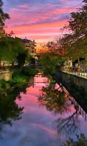 a view of a river at sunset at Efi's House in Florina +13 photos