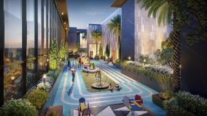 an aerial view of a building with people sitting around a pool at Lancaster Legacy Hotel & Apartments in Ho Chi Minh City