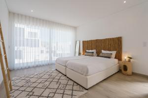 Postel nebo postele na pokoji v ubytování Areia Villa, with ocean view