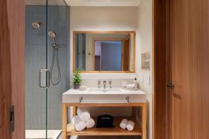 a bathroom with a sink and a shower at The Compton in Bentonville +31 photos