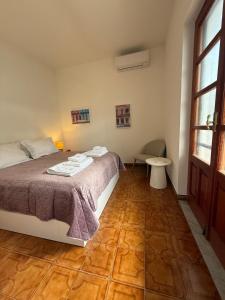 Katil atau katil-katil dalam bilik di Villa Montepaone