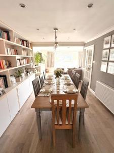 a dining room with a wooden table and chairs at Marlow Family Retreat, Short Stroll into Town in Marlow