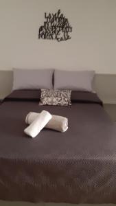 a bed with two towels on top of it at Bed& Breakfast G&G in Porto Garibaldi