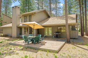 a house with a patio with a table and chairs at 14 Mt Hood Lane home in Sunriver +32 photos