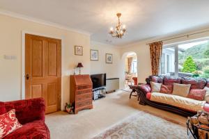 a living room with a couch and a tv at 2 Bed in Pooley Bridge oc-c33318 in Pooley Bridge