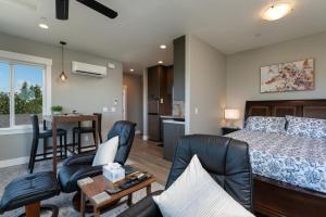 a bedroom with a bed and a living room at Eagles Bluff 1BR Suite of Kalama Oaks Lodge in Kelso