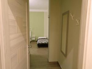Postel nebo postele na pokoji v ubytování San Andreas Suites