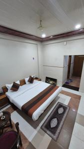a bedroom with a large bed in a room at Hotel dhola maru in Kota