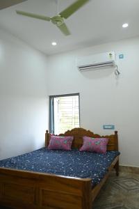 Ένα ή περισσότερα κρεβάτια σε δωμάτιο στο Muktadhara Eco Homestay