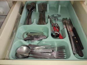 a tray filled with silver utensils in a drawer at GR - Polvorín Oasis in Valladolid