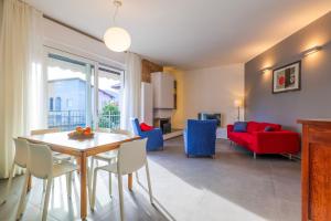 a dining room and living room with a table and chairs at Casa Augusta in Verbania +19 photos