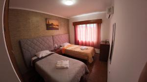 Ένα ή περισσότερα κρεβάτια σε δωμάτιο στο Apartamentos Lisboa +48 φωτογραφίες