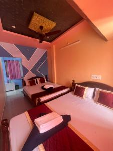 Postel nebo postele na pokoji v ubytování PANMOZHI RESIDENCY-luxury comfort stay + 24 fotografií