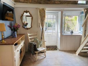 a room with a desk and a chair and a window at 2 Bedroom Cottage - Sleeps 6 - Pool - Garden in Caylus