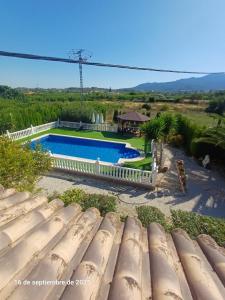 an overhead view of a swimming pool in a yard at Cortijo del carmen in Moratalla +13 photos