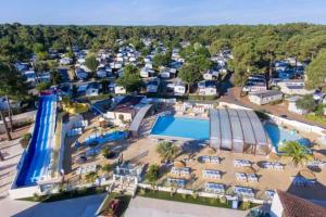 an aerial view of a pool at a resort at mobile home camping la pignade in La Tremblade