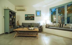 a living room with a coffee table and a couch at Villa Allegra in Kythira