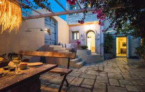 a patio with a table and chairs and a building at Villa Allegra in Kythira