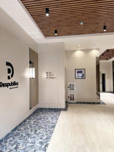 a lobby of a building with a tile floor at Apartments Жк Respublika новая евродвушка in Astana +12 photos