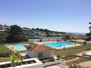 a view of a swimming pool with people in it at Campimeco by Campigir in Alfarim