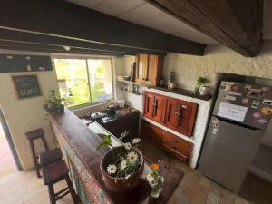 an overhead view of a kitchen with a counter and a refrigerator at Viejo Lobo in Cabo Polonio