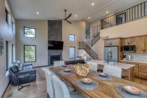 a kitchen and living room with a wooden table at Shadow Pines Lodge in Kirk