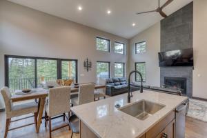 a kitchen and living room with a fireplace at Shadow Pines Lodge in Kirk