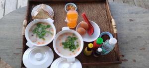 a tray with two bowls of soup and a drink at ณ มอร์ นอร์ เชียงใหม่ Mornor chaingmai in Ban Mae Na