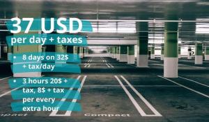 an empty parking lot with signs in a parking garage at Oceanfront Retreat Steps from Hollywood Beach in Hollywood Beach