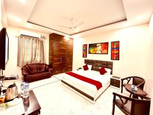 Ένα ή περισσότερα κρεβάτια σε δωμάτιο στο South Residency - South Delhi by South INN