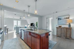a kitchen with a sink and a counter top at Elegant Three Bedroom Condo Near Rosemary Beach in Rosemary Beach