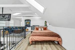 a bedroom with a bed in a white room at Skyline Loft in Buffalo +89 photos