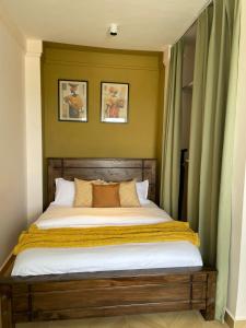 Ένα ή περισσότερα κρεβάτια σε δωμάτιο στο Afri-Naze Home near JKIA and SGR