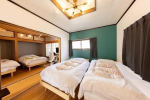 Un pat sau paturi într-o cameră la -Hitotoki- - Vacation STAY 10110v
