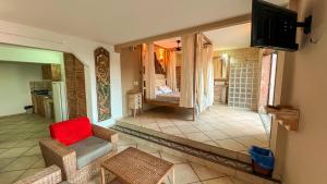 Μια τηλεόραση ή/και κέντρο ψυχαγωγίας στο Gávea Sunset Residence Hotel