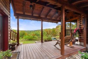 a wooden deck with a bench on a house at Family Mountain Escape w Private Suite Modern Comforts in Old Fields
