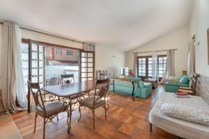 a living room with a table and chairs at 3-bedroom Villa in Golf del Sur in San Miguel de Abona