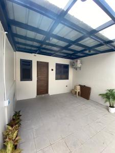 a room with a blue ceiling with a patio at Modern and Cozy 3BR Staycation Home in Tarlac