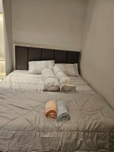 Ένα ή περισσότερα κρεβάτια σε δωμάτιο στο Apartment Roseville Suite & Soho BSD Serpong