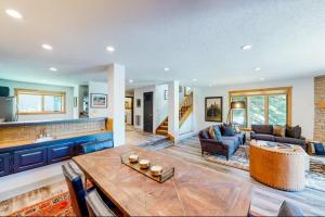a large living room with a table and a kitchen at Summit 2 Condo 2836 in Elkhorn Village