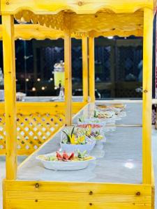 a row of plates of food on a table at Rum Crystal luxury camp in Wadi Rum