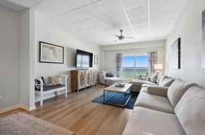 a living room with a couch and a table at Sans Souci Unit 204 in Villa Sabine