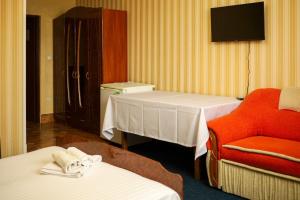 Ένα ή περισσότερα κρεβάτια σε δωμάτιο στο Hotel Diana